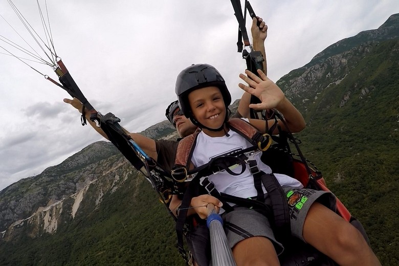 Paragliding Montenegro offer unforgettable adventure activity also for youngest tourists.